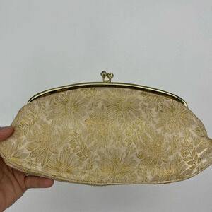 Vintage brocade clasp clutch. Ivory and gold stitching